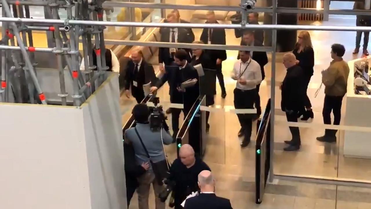 AFP officers enter the ABC's headquarters in Sydney to conduct a raid. Picture: Jason Om