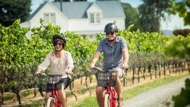 Cycling through the vines in Martinborough, New Zealand. Picture: Mike Heydon/JET Productions