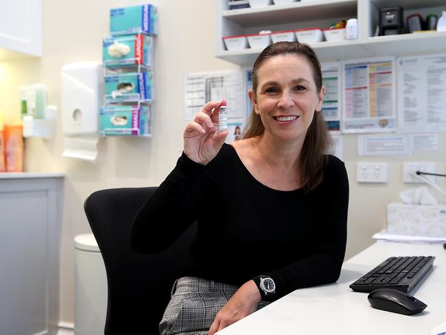 General Practioner, Dr Nicole Fogarty holding a vial of AstraZeneca vaccine, ahead of the phase roll-out on Monday at the Double Bay Doctors Practice, Sydney. Jane Dempster/The Australian.