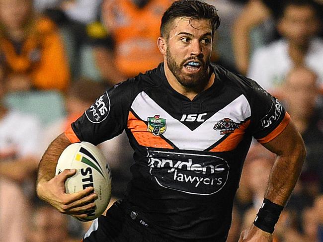 James Tedesco of the Tigers runs with the ball during the round 2 NRL match between the Wests Tigers and the Manly-Warringah Sea Eagles at Leichhardt Oval in Sydney, Monday, March 14, 2016. (AAP Image/Dan Himbrechts) NO ARCHIVING, EDITORIAL USE ONLY