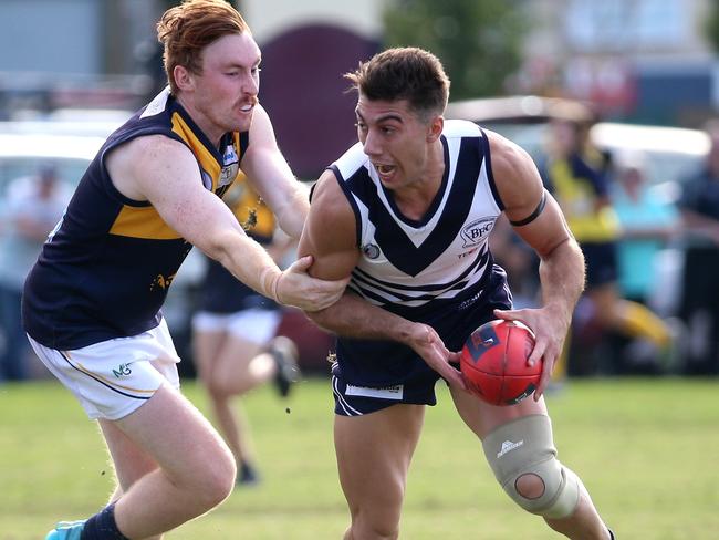 Lachlan Dyson of Whittlesea tackles Benjamin Young of Bundoora during the NFL footy match between Bundoora and Whittlesea played at Yulong Reserve in Bundoora on Saturday 7th May, 2016. Picture: Mark Dadswell