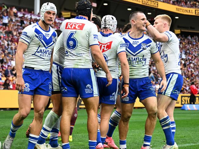 BRISBANE, AUSTRALIA - JULY 27: Bulldogs celebrate a try during the round 21 NRL match between Brisbane Broncos and Canterbury Bulldogs at Suncorp Stadium, on July 27, 2024, in Brisbane, Australia. (Photo by Albert Perez/Getty Images)