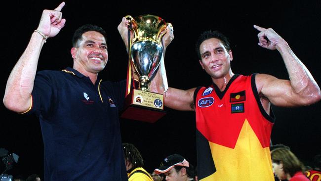 All Stars coach Michael McLean and captain Andrew McLeod acknowledge the crowd after beating Carlton in 2003. Picture: Michael Marschall