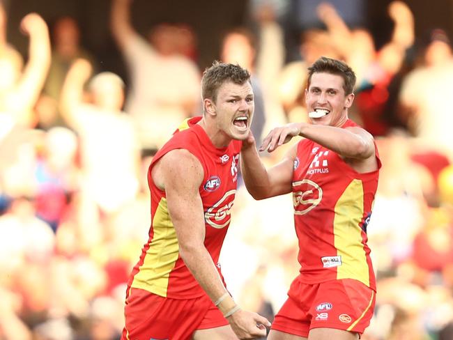 Nick Holman of the Suns celebrates a goal during the round four AFL match between the Gold Coast Suns and the Carlton Blues at Metricon Stadium on April 14, 2019 in Gold Coast, Australia. (Photo by Chris Hyde/Getty Images)