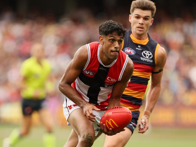 ADELAIDE, AUSTRALIA - MARCH 16: Nasiah Wanganeen-Milera of the Saints is tackled by Ben Keays of the Crows during the 2025 AFL Round 01 match between the Adelaide Crows and the St Kilda Saints at Adelaide Oval on March 16, 2025 in Adelaide, Australia. (Photo by James Elsby/AFL Photos via Getty Images)