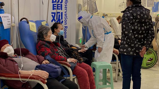 A health worker checks on Covid-19 coronavirus patients at the Second Affiliated Hospital of Chongqing Medical University. Picture: AFP