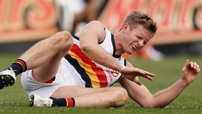 Alex Keath goes down hurt in the final round game against the Western Bulldogs, who are seeking to trade him. Picture: AAP Image/Scott Barbour