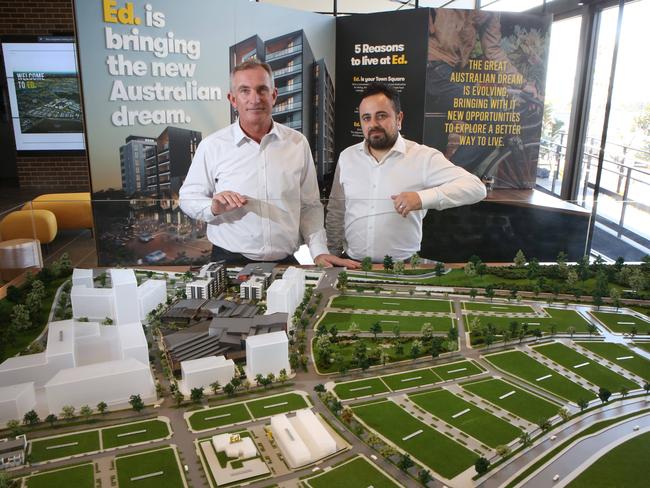 Fraser Property's general manager NSW residential Nigel Edgar and design director George Massoud with a model showing the Ed. Square development. Picture: Robert Pozo