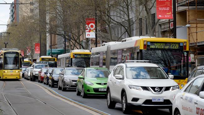 Cars come to a standstill in King William St as the Chinese delegation’s motorcade head the Intercontinental Hotel. Pic. Greg Higgs