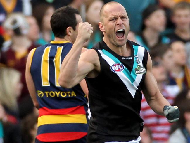 AFL football round 19 Showdown XXXI match between Adelaide Crows and Port Adelaide Power at AAMI Stadium. Chad Cornes celebrates kicking the opening goal.