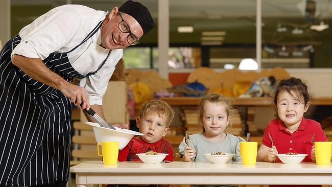 C&amp;K Kedron chef Simon Cummins with Charlie, 3, Isabella, 4, and Skye, 4. Picture: Josh Woning