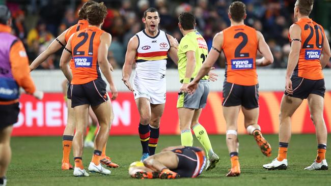 Josh Kelly lies injured after a sling tackle from Taylor Walker.