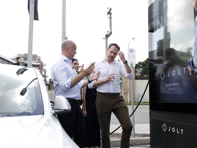 DAILY TELEGRAPH FEBRUARY 12, 2023. Treasurer and Minister for Energy Matt Kean plugging in his electric vehicle at the Park&Ride car park in Narrabeen with Jolt CEO Doug McNamee after making an electric vehicle announcement. Picture: Jonathan Ng