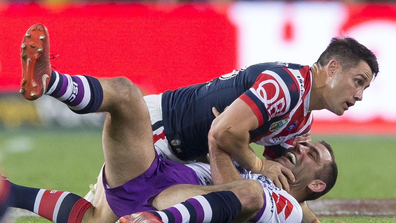 Cameron Smith tackles Cooper Cronk during the grand final.