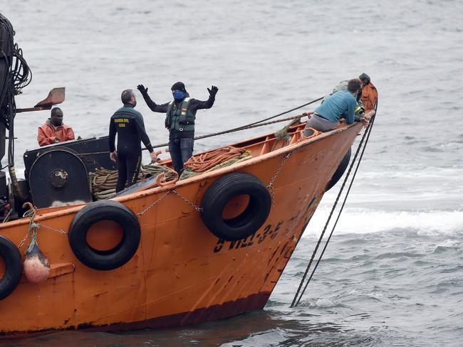 Spanish Guardia Civil's divers work to refloat a submarine, used to transport drugs illegally, in Aldan, northwestern Spain. Picture: AFP