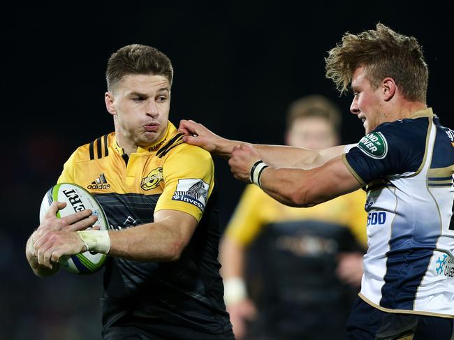 NAPIER, NEW ZEALAND - APRIL 21:  Beauden Barrett of the Hurricanes fends Jordan Jackson-Hope of the Brumbies during the round nine Super Rugby match between the Hurricanes and the Brumbies at McLean Park on April 21, 2017 in Napier, New Zealand.  (Photo by Hagen Hopkins/Getty Images)