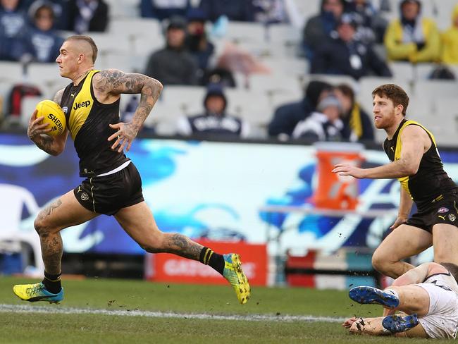 AFL Round 13. 17/06/2018.  Geelong v Richmond at the MCG .   Richmond's Dustin Martin charges forward   . Pic: Michael Klein