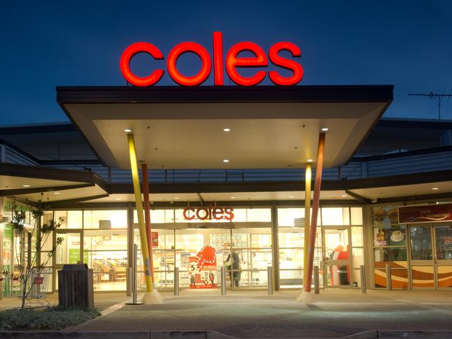 Sydney, Australia - July 25, 2013: The entrance to a brightly lit Coles supermarket in Ropes Crossing at dusk.