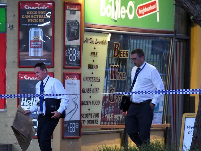 Detectives take evidence from the scene of a fatal shooting at Park Orchards. Picture: Nicole Garmston