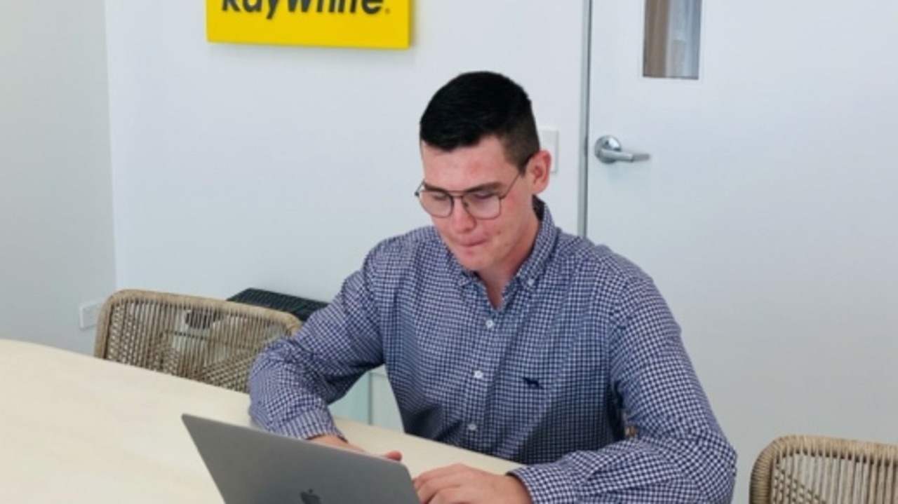 Damon Walker hard work at his employer's office, Ray White Commercial Burleigh. Image supplied.