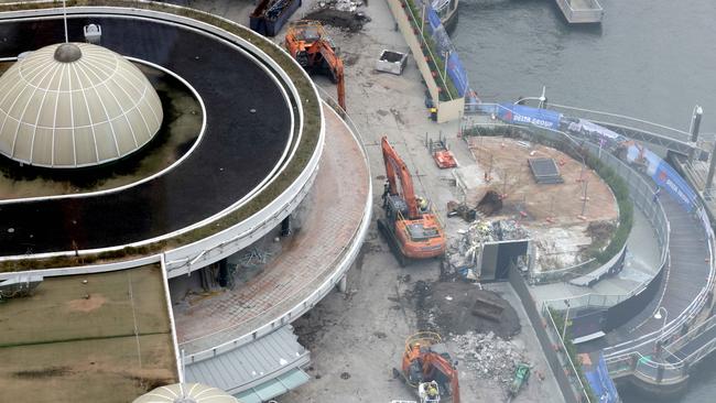 March 2023: Workers on site during the demolition of Eagle Street Pier. Picture: Steve Pohlner