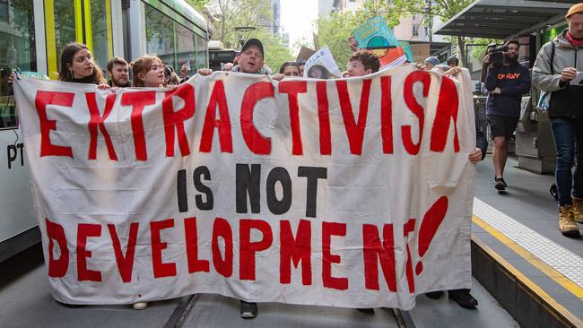 Activists marching down Collins St. Picture: Sarah Matray