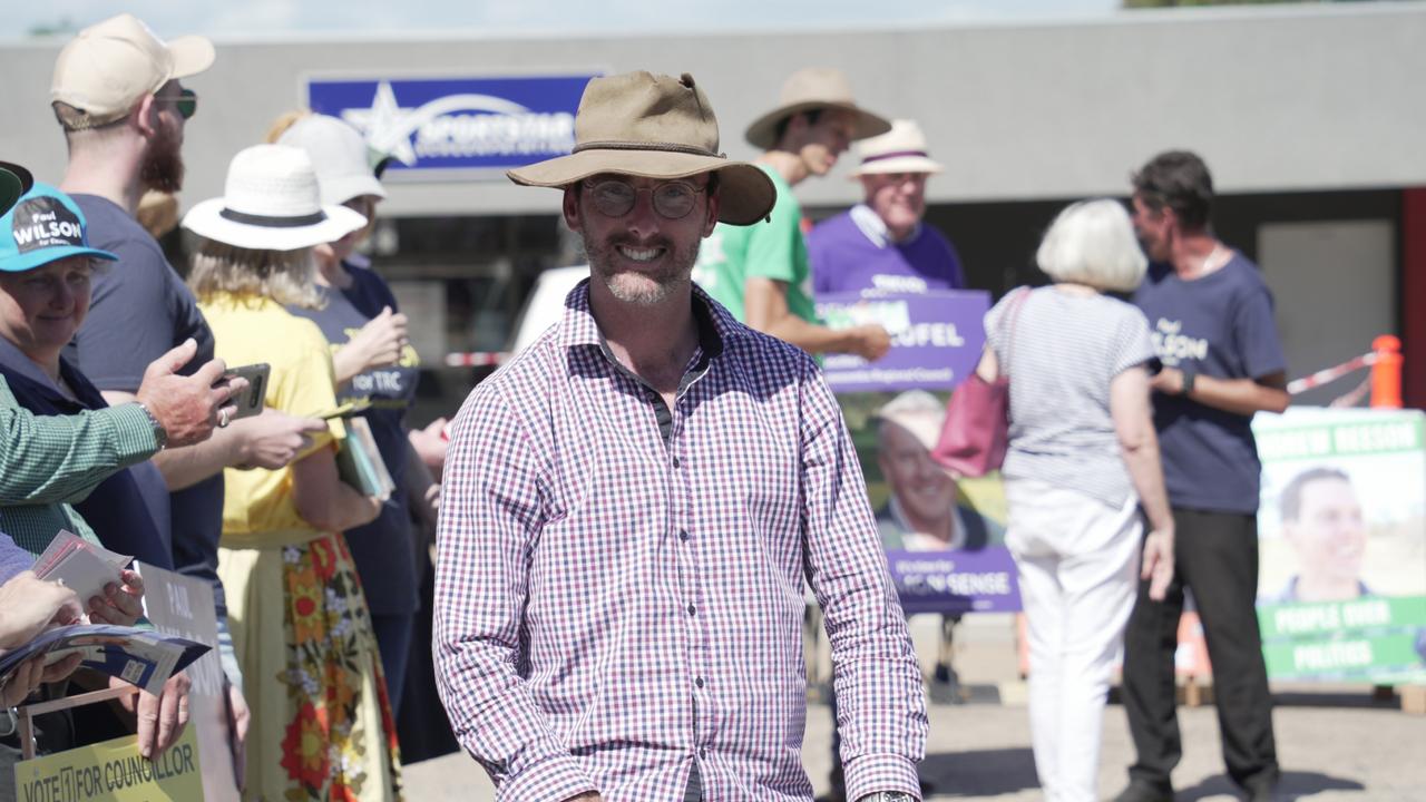 Say No To Woke council candidate Nathan Essex stands at the Toowoomba pre-polling centre in Newtown.