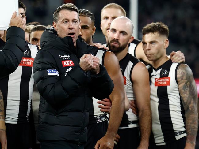 MELBOURNE, AUSTRALIA - JULY 12: Craig McRae, Senior Coach of the Magpies addresses his players during the 2024 AFL Round 18 match between the Collingwood Magpies and the Geelong Cats at Melbourne Cricket Ground on July 12, 2024 in Melbourne, Australia. (Photo by Michael Willson/AFL Photos via Getty Images)