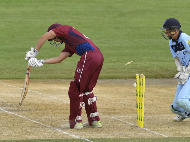 ALICE SPRINGS, AUSTRALIA - FEBRUARY 03: Brock McLachlan of Queensland is bowled out by Benjamin Mitchell of New South Wales during the National Indigenous Cricket Championships Men's Final match between New South Wales and Queensland at Traeger Park on February 03, 2020 in Alice Springs, Australia. (Photo by Albert Perez - CA/Cricket Australia via Getty Images)