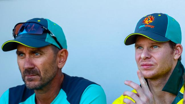 Justin Langer (L) and Steve Smith talk tactics during the second practice match. Picture: AFP