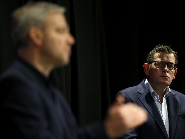 MELBOURNE, AUSTRALIA - JULY 31: Victoria Premier Daniel Andrews listens to Victoria's Chief Health Officer Professor Brett Sutton address the media at the daily briefing on July 31, 2020 in Melbourne, Australia. Victoria recorded 627 new COVID-19 cases and eight deaths on Thursday, July 30. As of Sunday mask will be compulsory state-wide, with additional restrictions in specific regional areas that have seen an uptick in new cases. (Photo by Darrian Traynor/Getty Images)