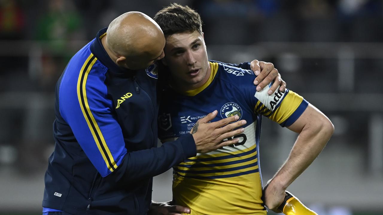 Brad Arthur consoles Mitch Moses.