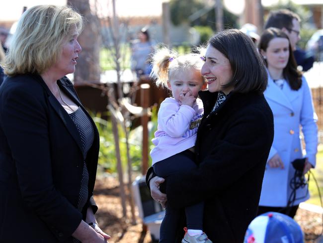 NSW Premier Gladys Berejiklian visiting Wagga Wagga holding Ivy Everingham (2) with Liberal candidate Julia Ham. Picture: Brad Newman