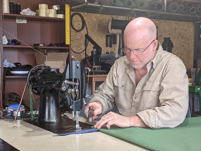 craig vine in his studio in Tawonga making swags.