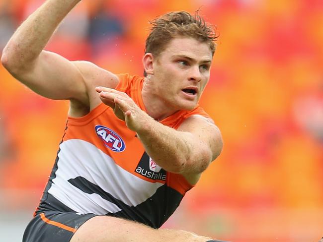 SYDNEY, AUSTRALIA - APRIL 06: Heath Shaw of the Giants kicks during the round three AFL match between the Greater Western Sydney Giants and the Melbourne Demons at Spotless Stadium on April 6, 2014 in Sydney, Australia. (Photo by Mark Kolbe/Getty Images)