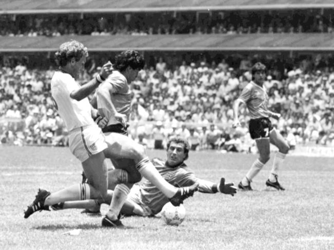 Argentina's Diego Maradona, second left, drives home past England's goalkeeper Peter Shilton. Pic: AP