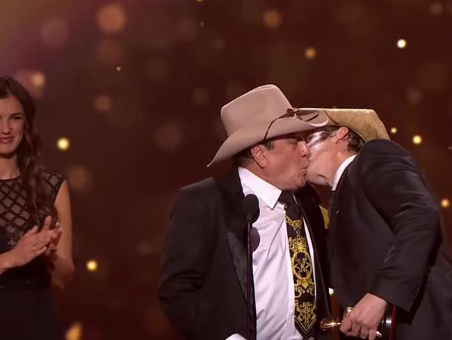 Molly Meldrum and Samuel Johnson lock lips after Johnson won the Gold Logie.