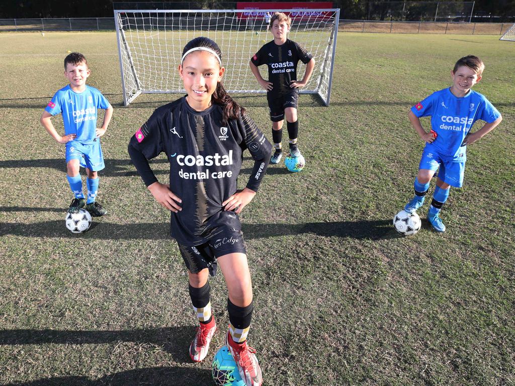 Akira Booth (front middle) is one of Queensland’s gun young female footballers. Picture Glenn Hampson