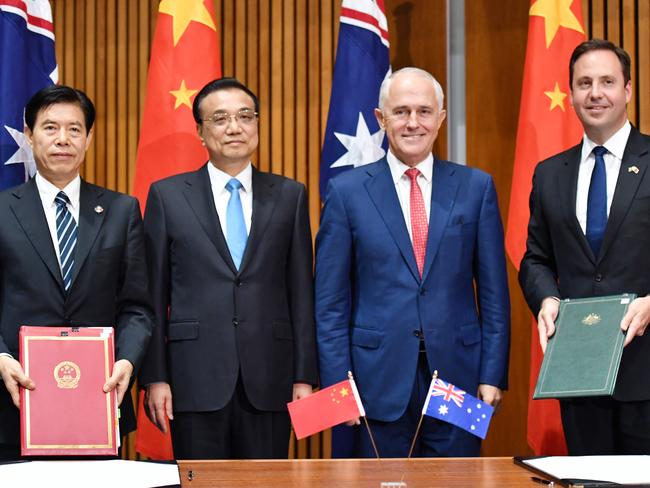 (L-R) Chinese Minister of Commerce Zhong Shan, Premier of the State Council of the People's Republic of China Li Keqiang, Australia's Prime Minister Malcolm Turnbull and Australia's Minister for Trade Steven Ciobo at a signing ceremony in Canberra in March 2017. Picture: AAP