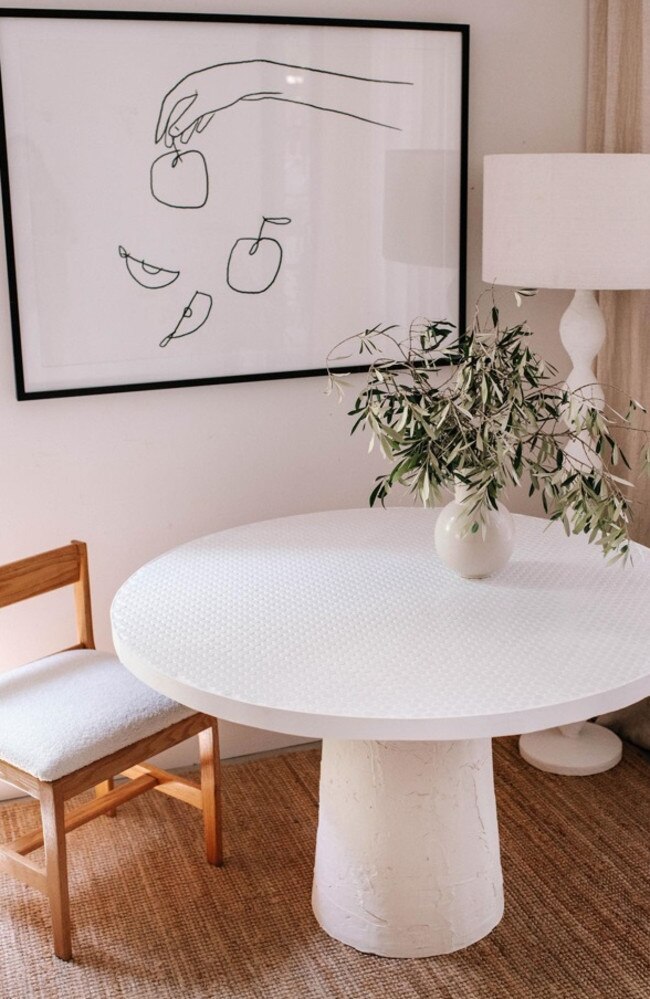 She transformed it into this classy white-tiled pedestool table. Picture: Instagram/genevavanderzeil