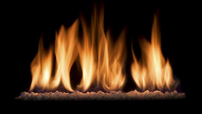 the beautiful flames of a gas fire isolated against a black background.