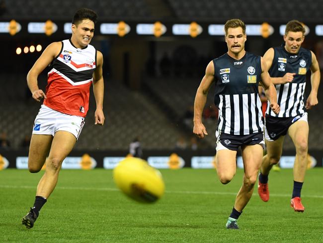 Joe Fisher and Tom Ruggles chase the ball. Picture: James Ross/AAP