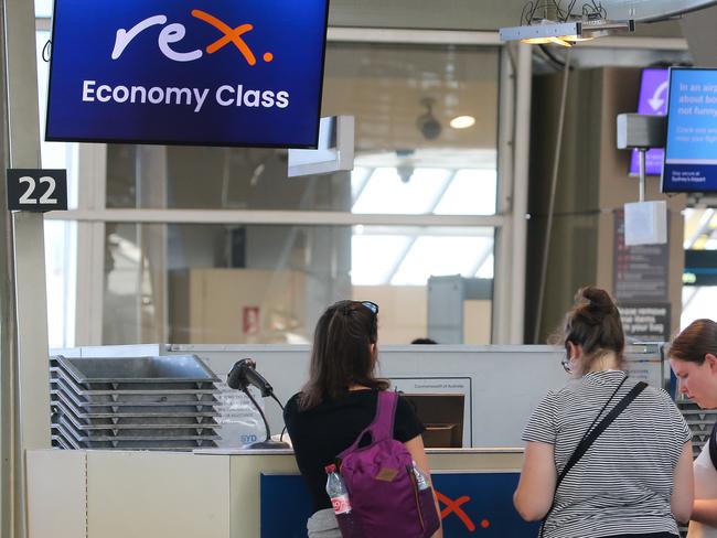 SYDNEY, AUSTRALIA - Newswire Photos MARCH 07 2023: A general view of people seen checking in to flights at Rex as a shortage of Air Traffic controllers at Sydney Airport has caused one third of flights to be delayed. Picture: NCA Newswire / Gaye Gerard