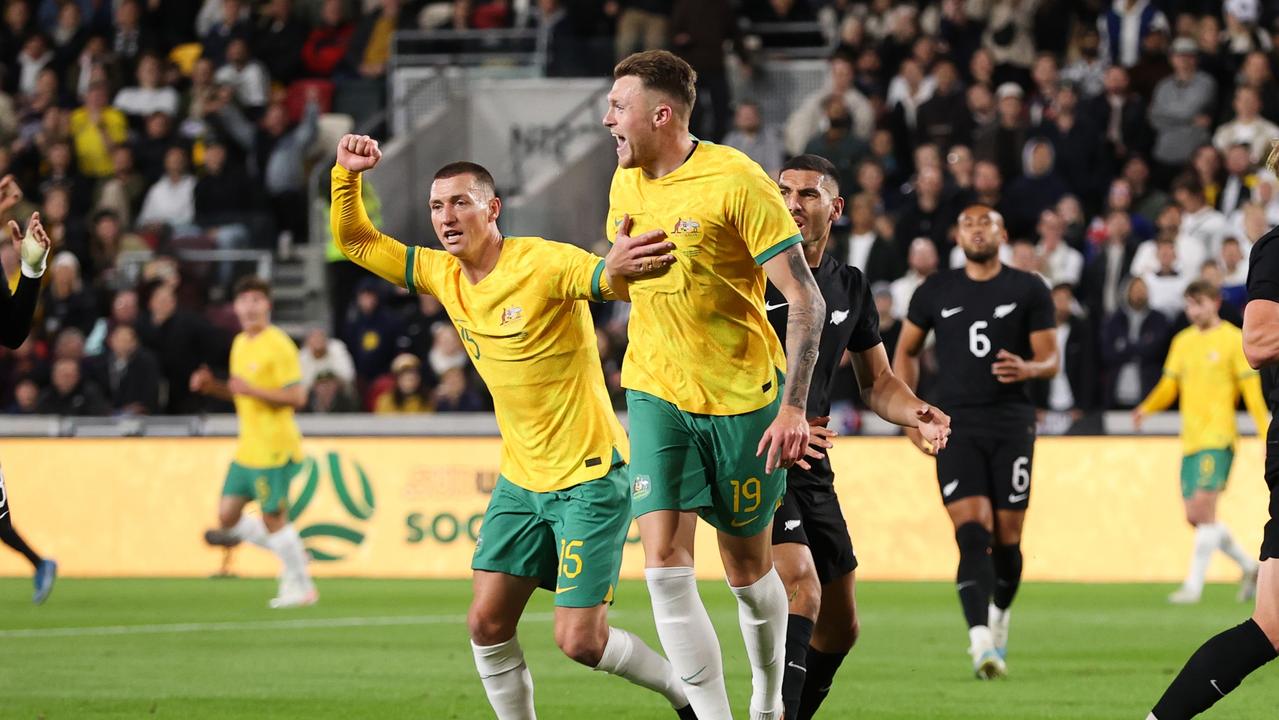 Mitch Duke (left) celebrates with teammate Harry Souttar after the team's first goal. Picture: Ryan Pierse/Getty Images