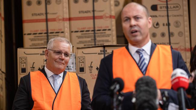 Prime Minister Scott Morrison in a Sydney factory media event with treasurer Josh Frydenberg. Picture: Jason Edwards