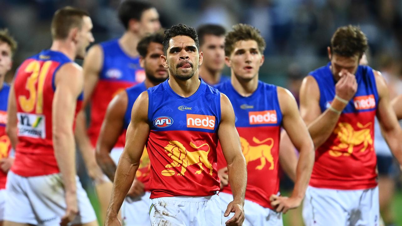 GEELONG, AUSTRALIA - MARCH 26: Charlie Cameron and his Lions team mates look dejected after losing the round 2 AFL match between the Geelong Cats and the Brisbane Lions at GMHBA Stadium on March 26, 2021 in Geelong, Australia. (Photo by Quinn Rooney/Getty Images)