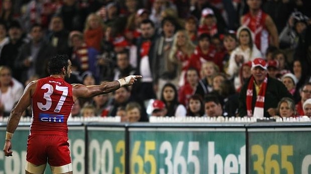 Sydney champion Adam Goodes points at a fan during the Swans and Collingwood Magpies game at the MCG.