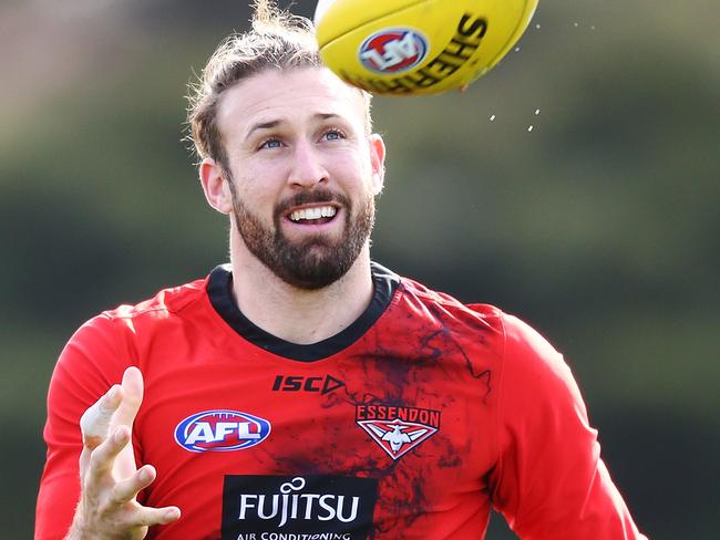 MELBOURNE, AUSTRALIA - JULY 26: Cale Hooker of the Bombers gathers the ball  during an Essendon Bombers AFL training session at The Hangar on July 26, 2018 in Melbourne, Australia.  (Photo by Michael Dodge/Getty Images)