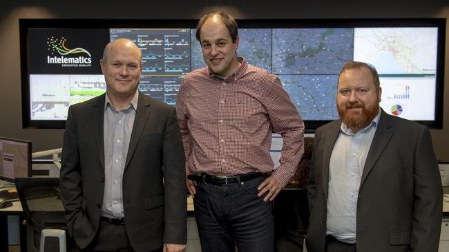 Steven Maloney, Boris Savkovic and Dan Kelly in the Intelematics control room. Picture: Andy Brownbill