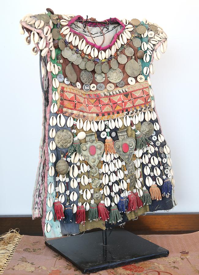 <b>Baby’s robe:</b> This baby’s robe from Afghanistan was created in the period when the USSR were occupying the country. It’s embellished with Russian coins and sea shells.